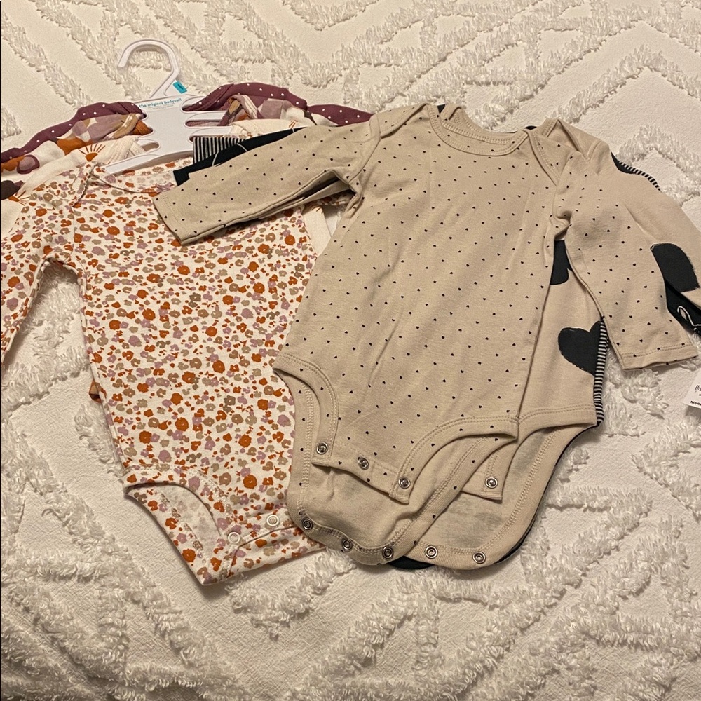 Carter's long sleeve body suit sets. New with tags. 6 months. Great for twins.